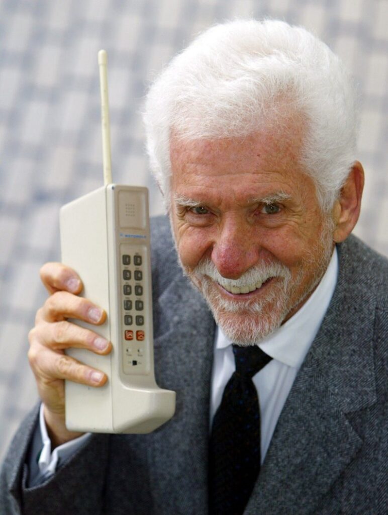 Martin Cooper. Using a hefty Motorola DynaTAC prototype